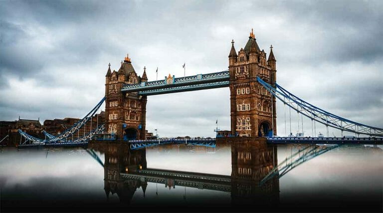 The Tower Bridge in London above a misty river